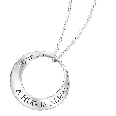 A Hug pendant in Sterling Silver or 14K Gold from Winnie the Pooh