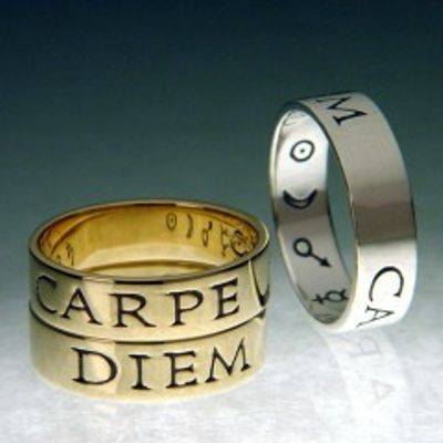 "Carpe Diem Ring" (seize the day).  Latin poesy rings in gold or silver.  